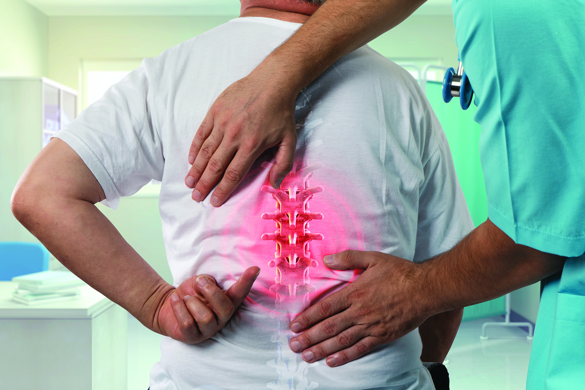 doctor with patient looking at his spine